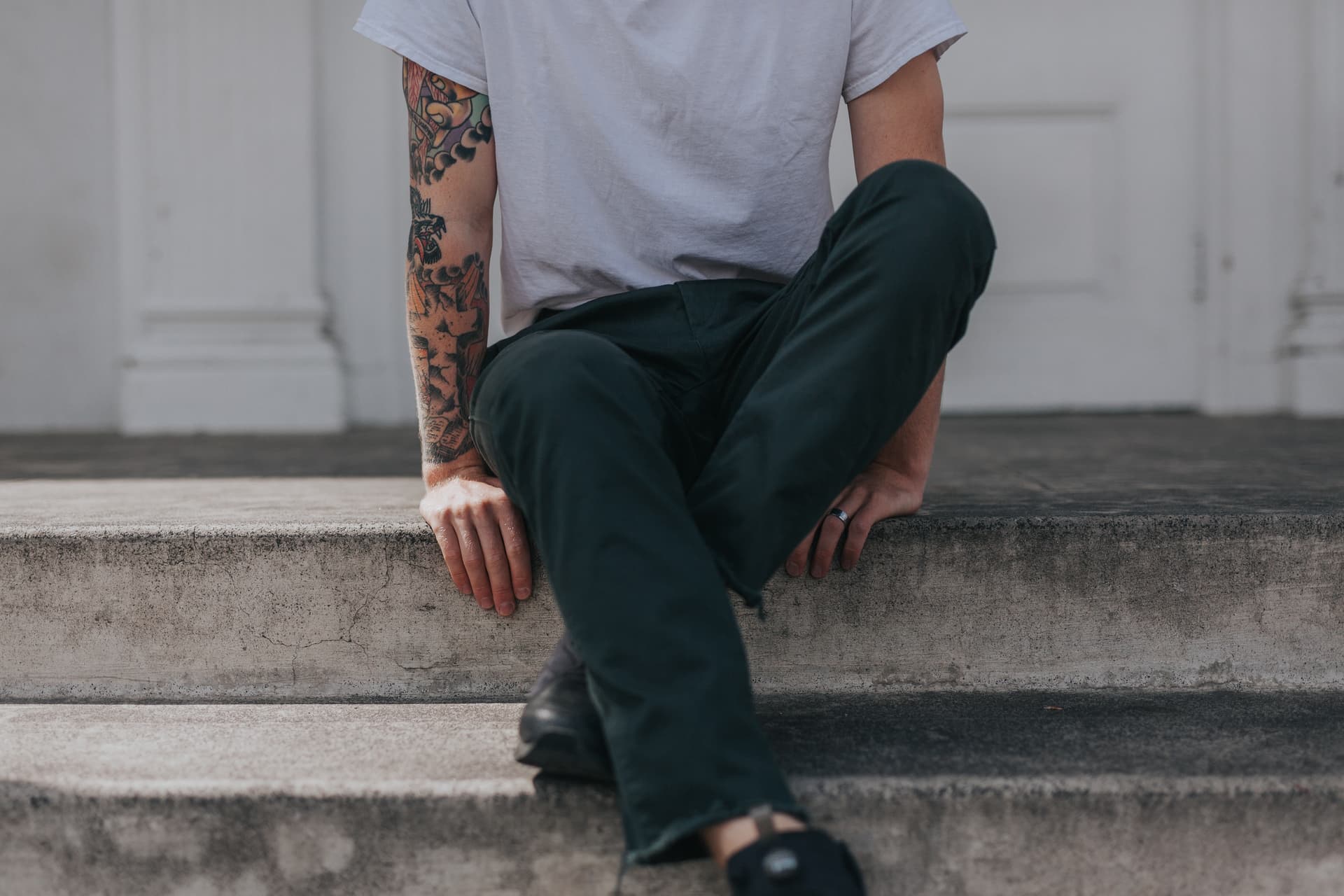 man wearing grey crew neck t-shirt sitting near window_edited.jpg