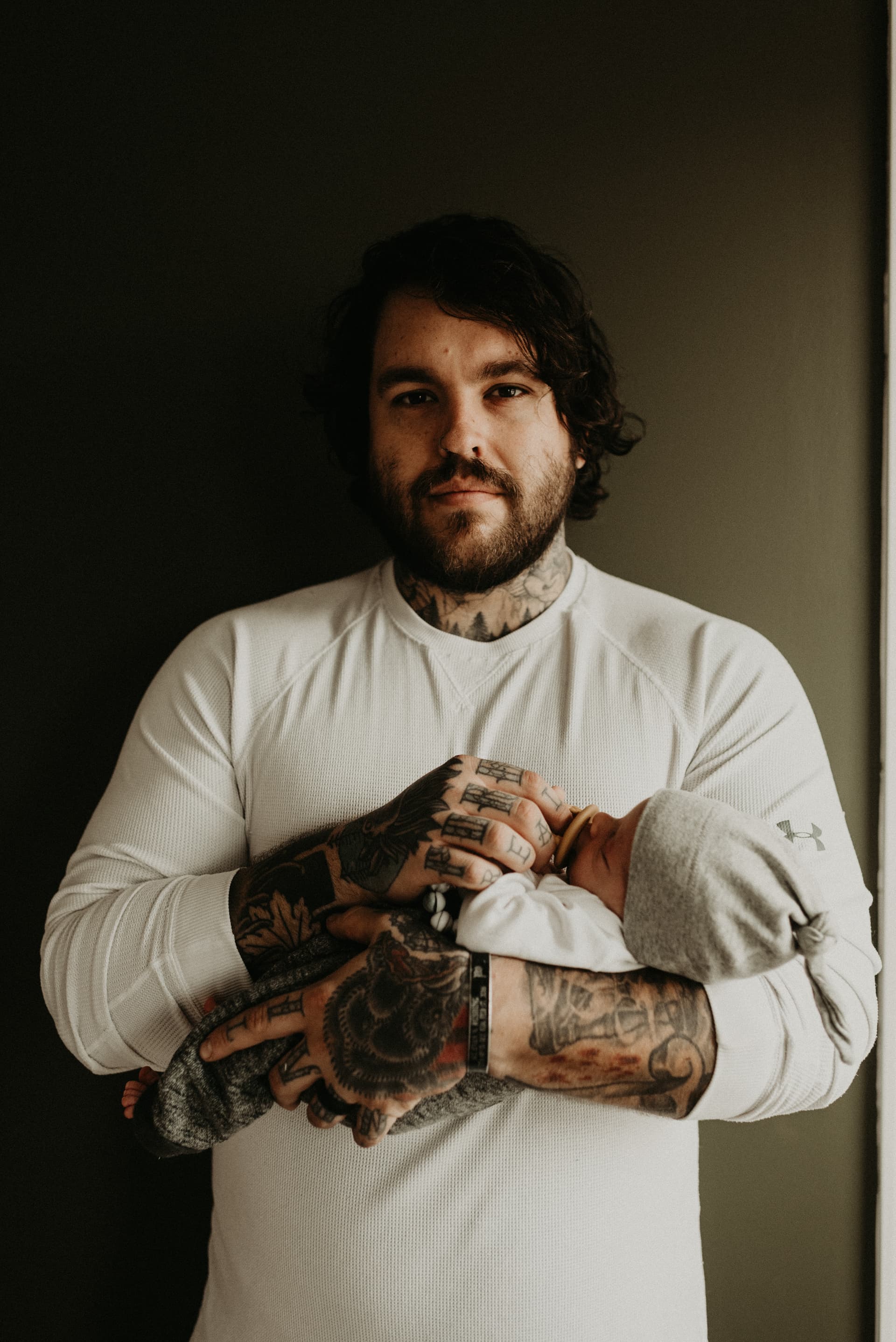 A person at a kitchen table in morning light.